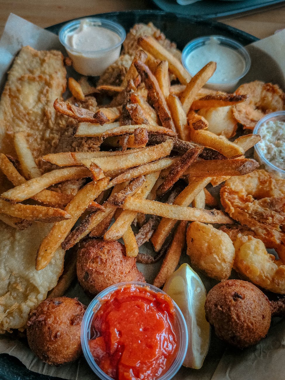 delicious southern fried seafood platter with sauces