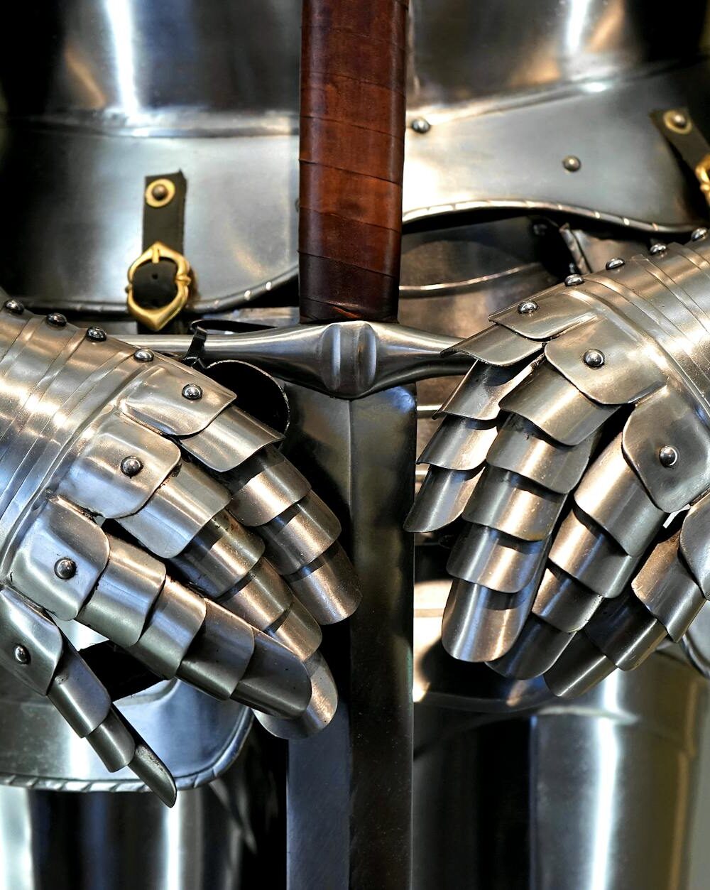 silver and brown sword and armor