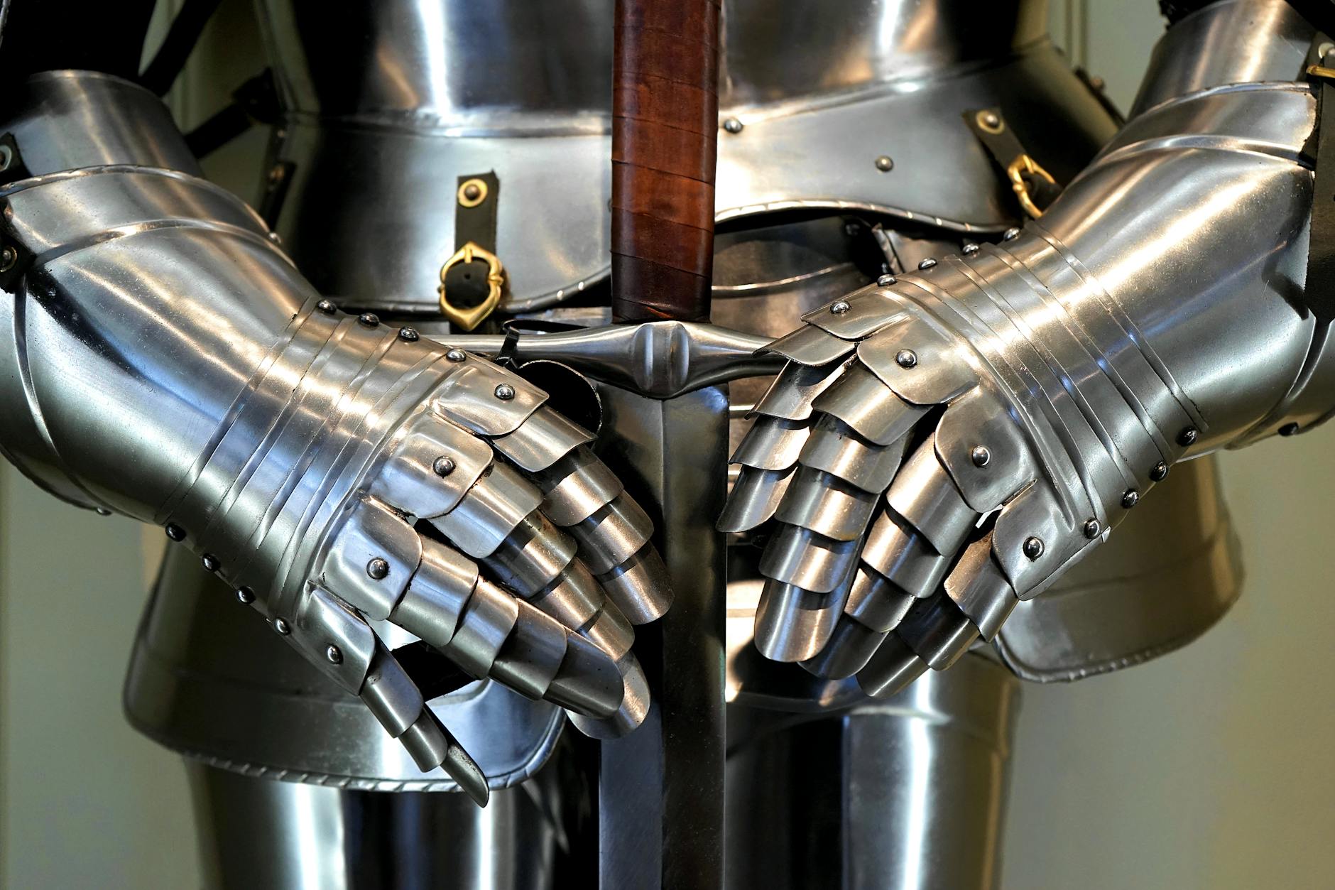 silver and brown sword and armor