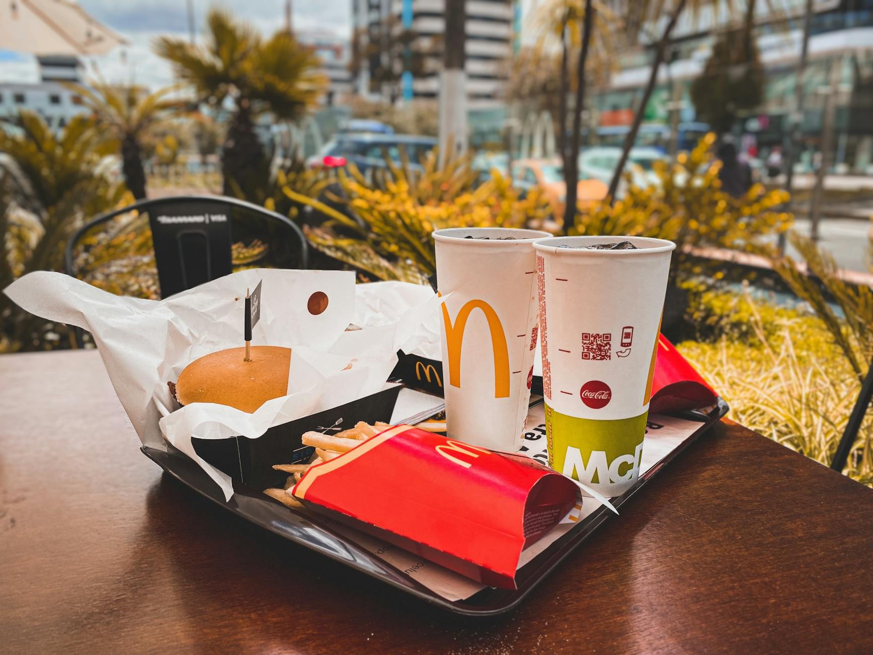 hamburger and drinks on a tray