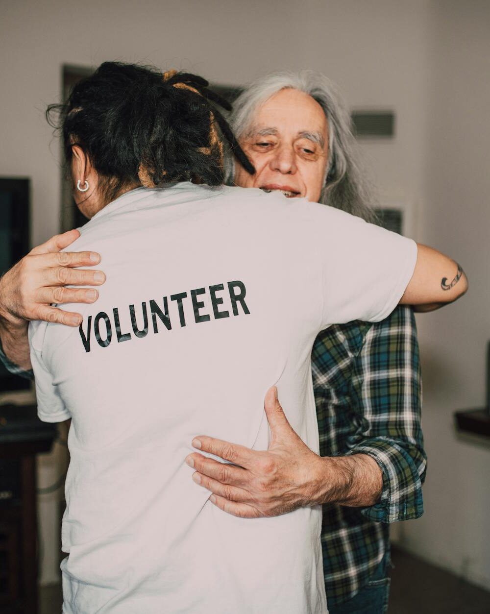 two people hugging each other