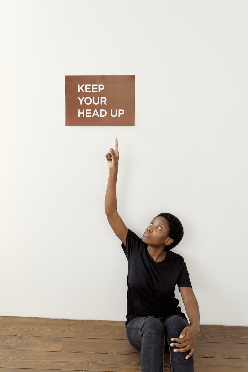 female advocate holding a brown placard