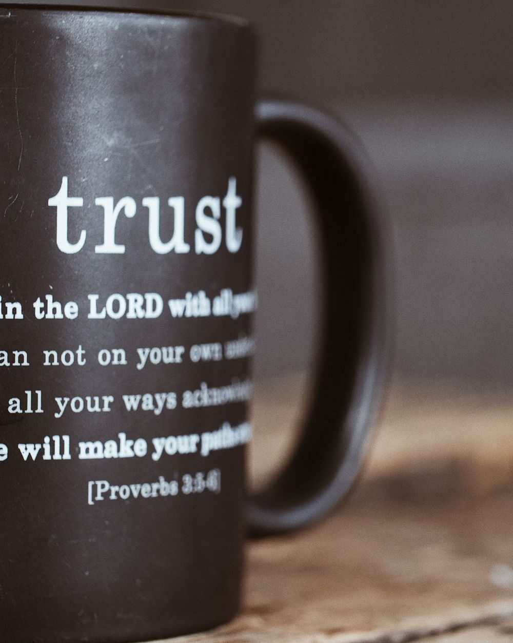 black mug with proverb from holy bible