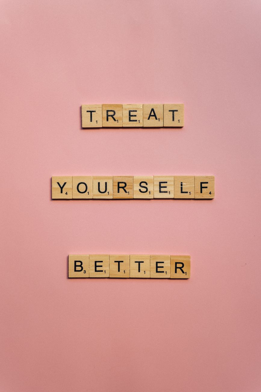 treat yourself better text on pink background